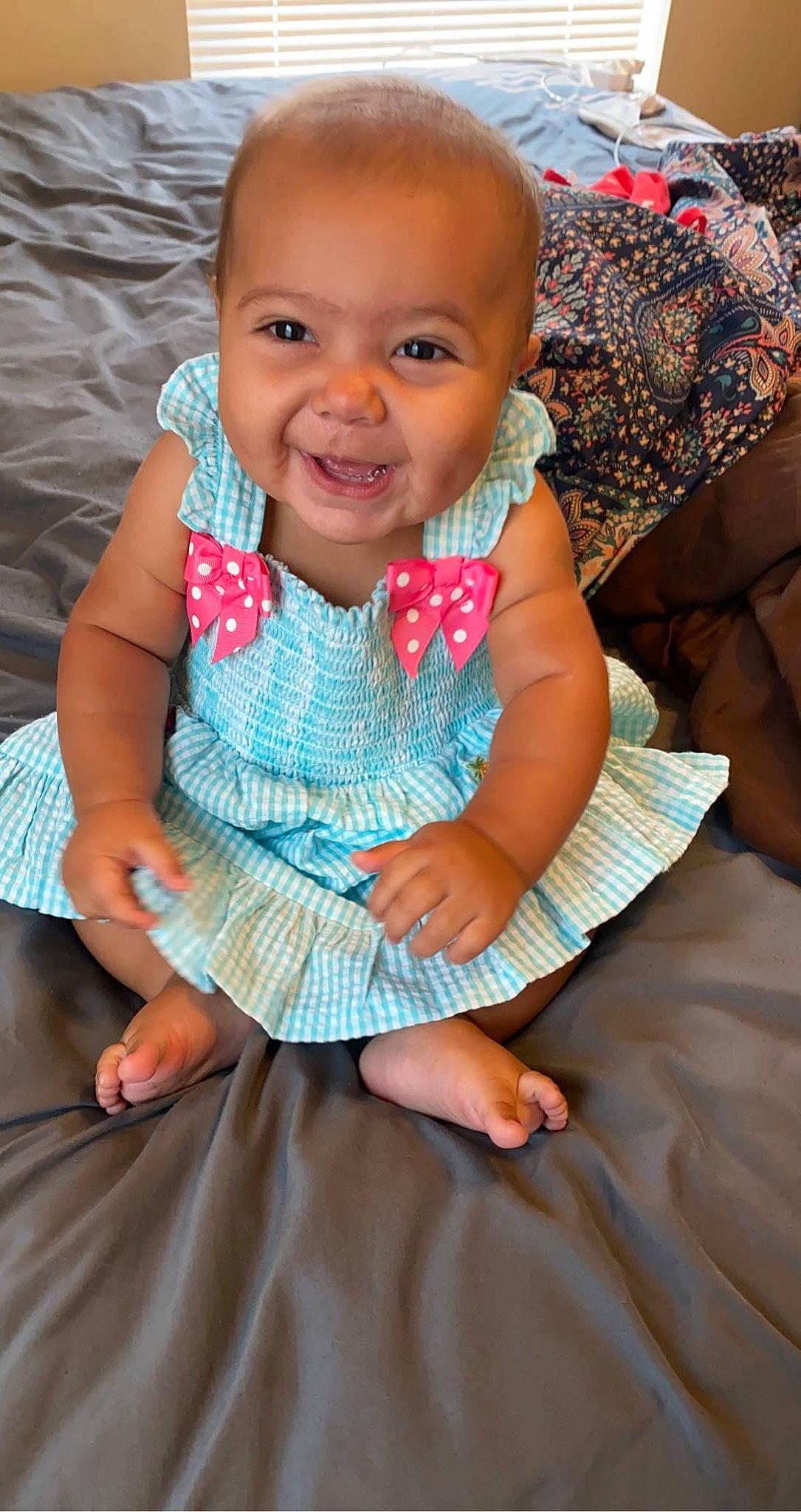 Emberlynn is registered to the contest to win money with this photo: baby_toddler_clothing, cheek, chin, dress, eye, finger, gesture, hand, happy, head, human, iris, joy, lip, mouth, nose, person, pink, skin, sleeve