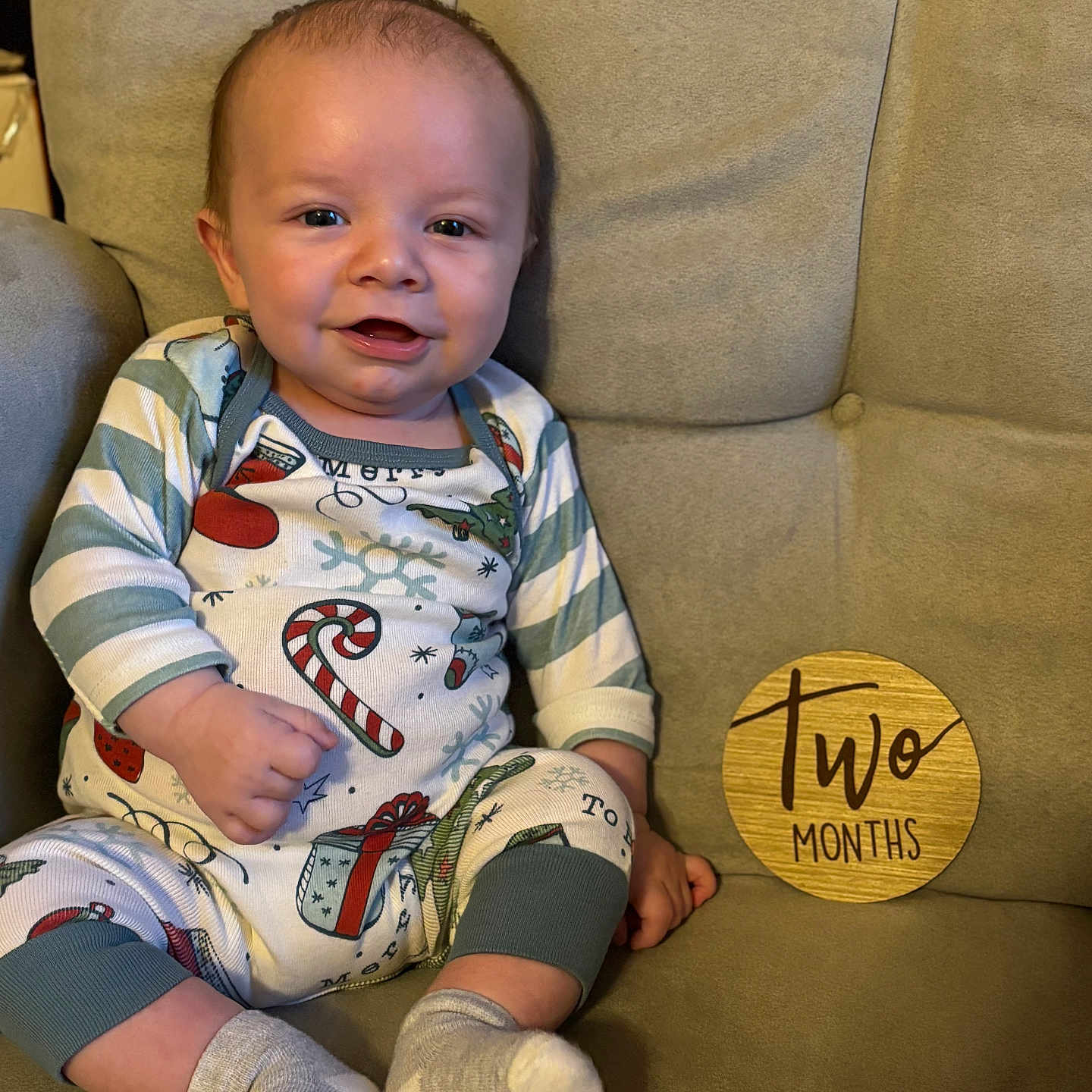 River is registered to the contest to win money with this photo: baby, chair, clothing, couch, cushion, face, footwear, furniture, head, homedecor, hosiery, pants, person, photography, portrait, shoe, sitting, sneaker, sock, t_shirt