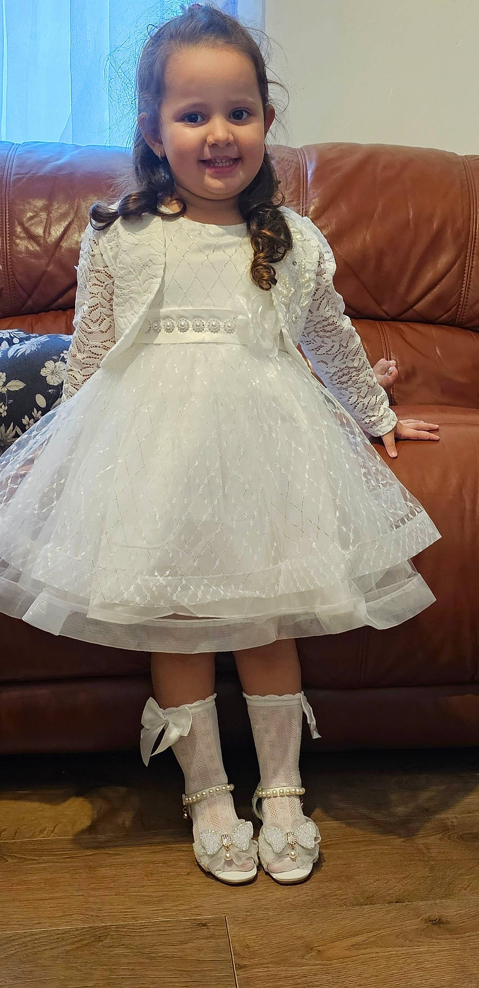 Katerina is registered to the contest to win money with this photo: child, clothing, couch, dress, face, female, footwear, formalwear, furniture, girl, head, person, photography, portrait, sandal, shoe, sitting, sleeve, sneaker, standing