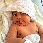 Akiro is registered to the contest to win money with this photo: baby, towel, hood, smile, tongue, blanket, skin, cheek, arm, cute, infant, child, face, eyes, soft, cozy, indoors, happy, portrait, person
