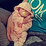 Kai joined the competition — help win amazing prizes! baby, pacifier, hoodie, pink_clothing, adult_hand, blanket, sitting, cozy, infant, child, person, casual_clothing, relaxing, indoor, comfort, sleepy, cute, small_hands, resting, care