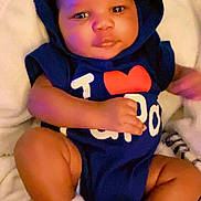 Adin joined the competition — help win amazing prizes! baby, infant, hoodie, onesie, socks, blanket, lying_down, cute, child, face, skin, comfort, soft, indoor, portrait, small_hands, small_feet, clothing, expression, young