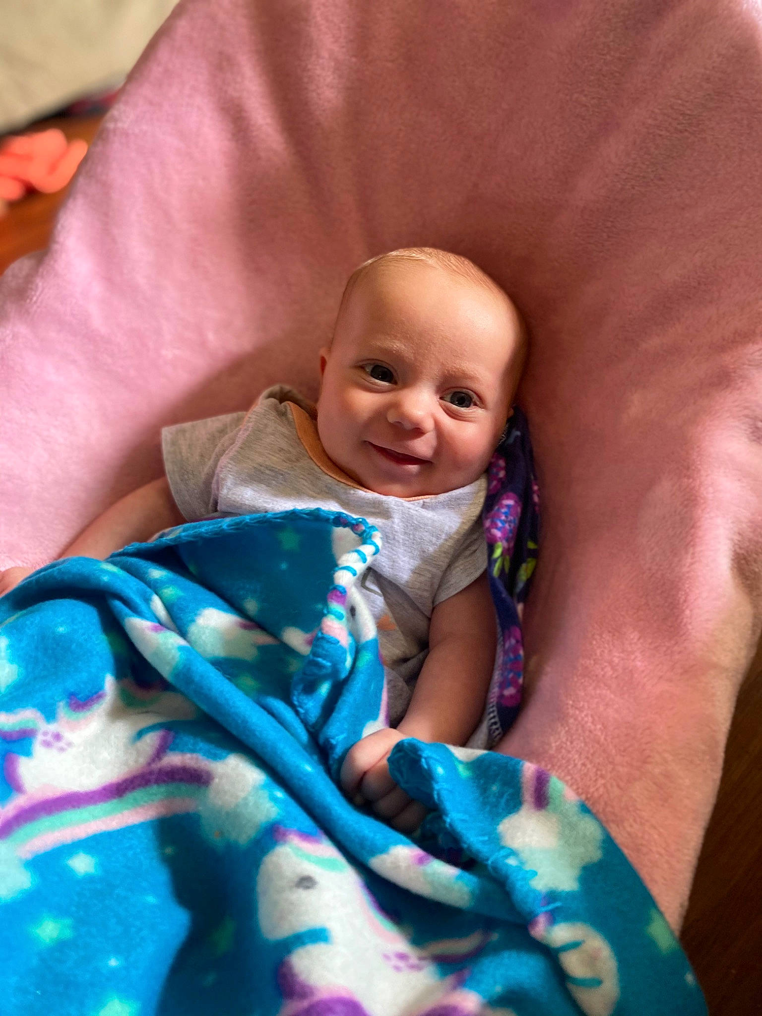 Lillith is registered to the contest to win money with this photo: baby, baby_products, baby_toddler_clothing, cheek, child, comfort, electric_blue, event, eyebrow, finger, happy, iris, joy, linens, magenta, mouth, person, pink, purple, skin