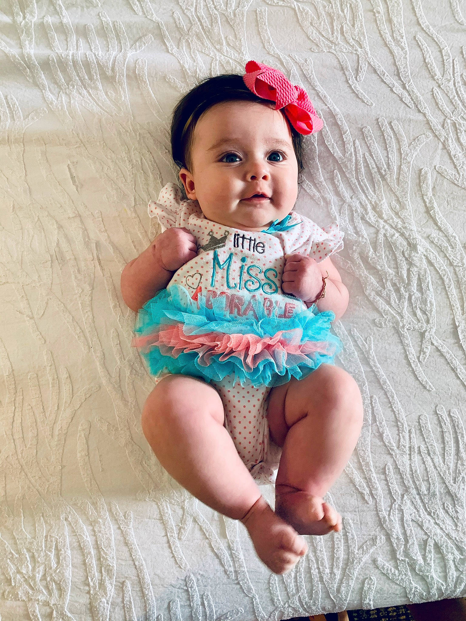 Berkley is registered to the contest to win money with this photo: baby, baby_bloomers, baby_products, baby_toddler_clothing, cheek, child, child_model, fashion_accessory, hair_accessory, headband, headgear, headpiece, person, photography, pink, sitting, skin, smile, textile, toddler