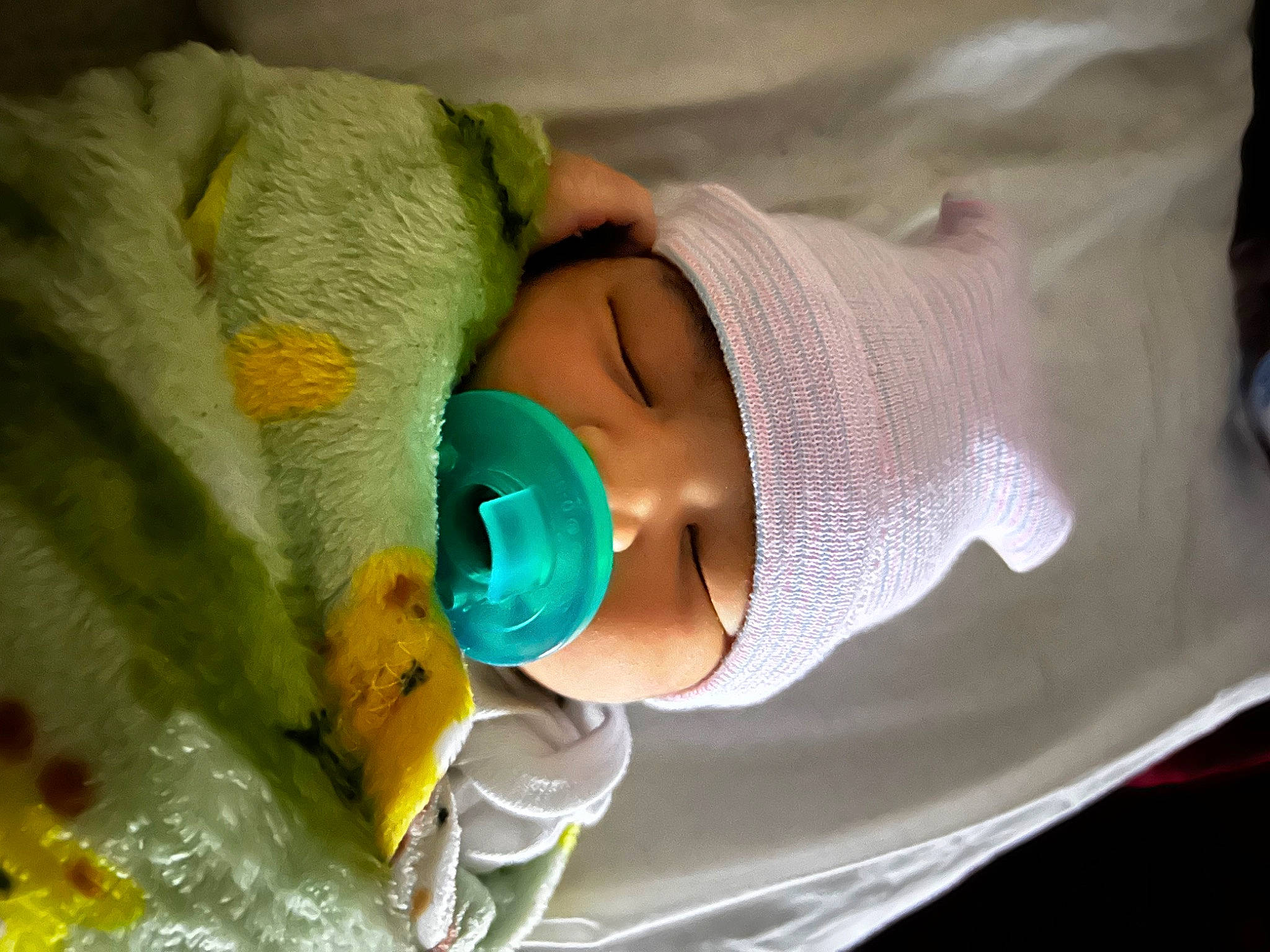 Emonie is registered to the contest to win money with this photo: baby, baby_products, baby_toddler_clothing, child, comfort, event, eyelash, face, fluid, hat, headgear, headwear, health_care, medical, medical_equipment, person, plastic, plastic_bottle, service, sun_hat