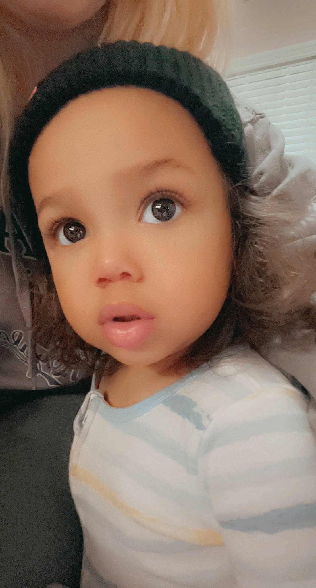 Kobe is registered to the contest to win money with this photo: black_hair, brown_hair, cap, cheek, child, ear, eye, eyelash, fashion_accessory, flash_photography, forehead, helmet, iris, jaw, lip, no_expression, nose, person, selfie, skin