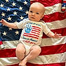 baby, infant, american_flag, onesie, celebration, 4th_of_july, patriotic, red, white, blue, stars, stripes, holiday, decorations, child, portrait, cute, laying_down, person, festive