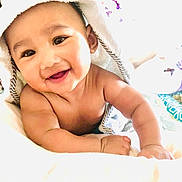 Omar joined the competition — help win amazing prizes! baby, smiling, towel, panda, cute, infant, child, happy, portrait, skin, blanket, face, eyes, mouth, drool, arm, hand, indoors, soft, bright