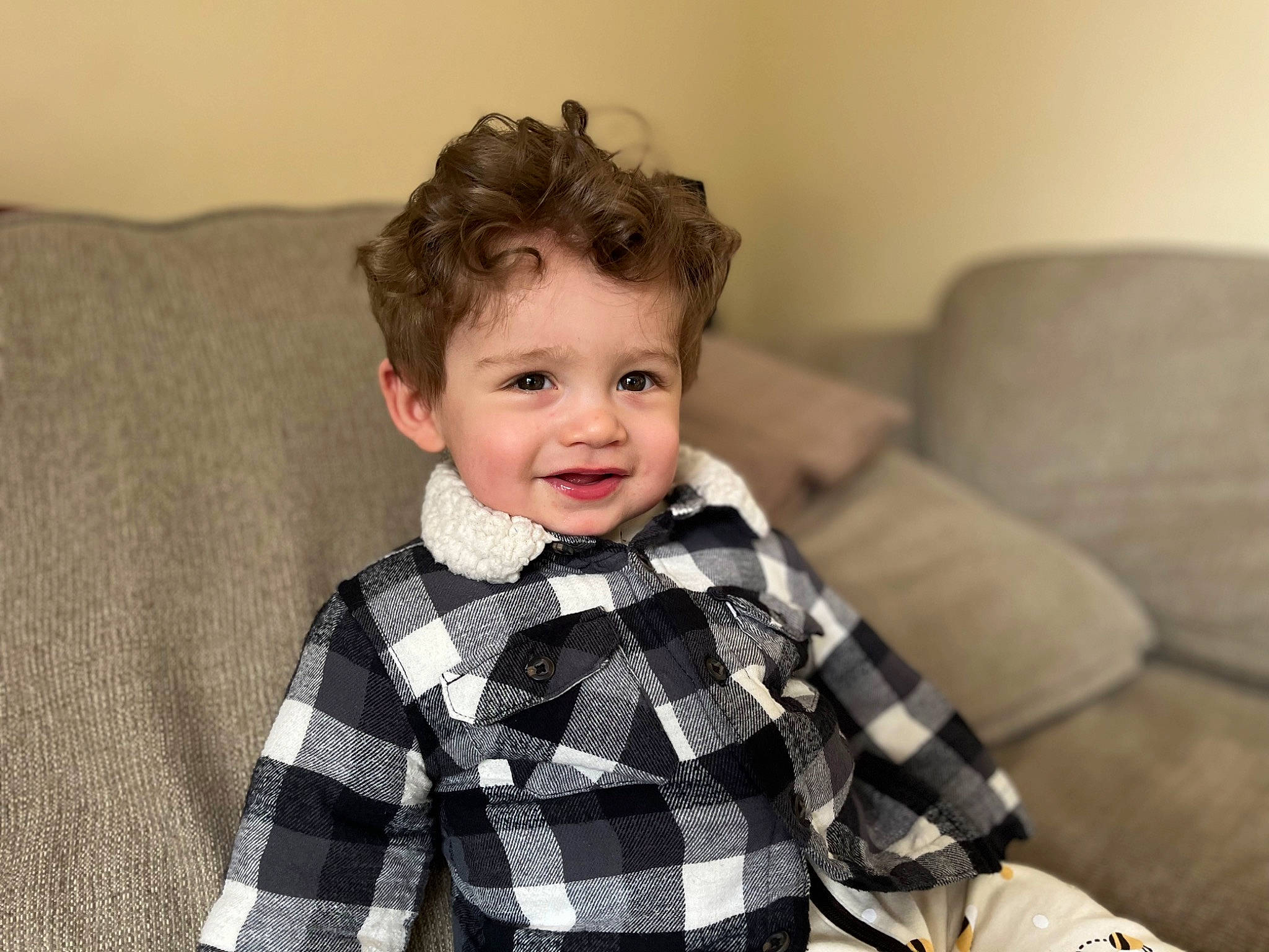 Kaleb joined the competition — help win amazing prizes! baby_toddler_clothing, child, collar, comfort, couch, dress_shirt, eye, face, flash_photography, hair, happy, head, joy, outerwear, pattern, person, plaid, sitting, sleeve, smile