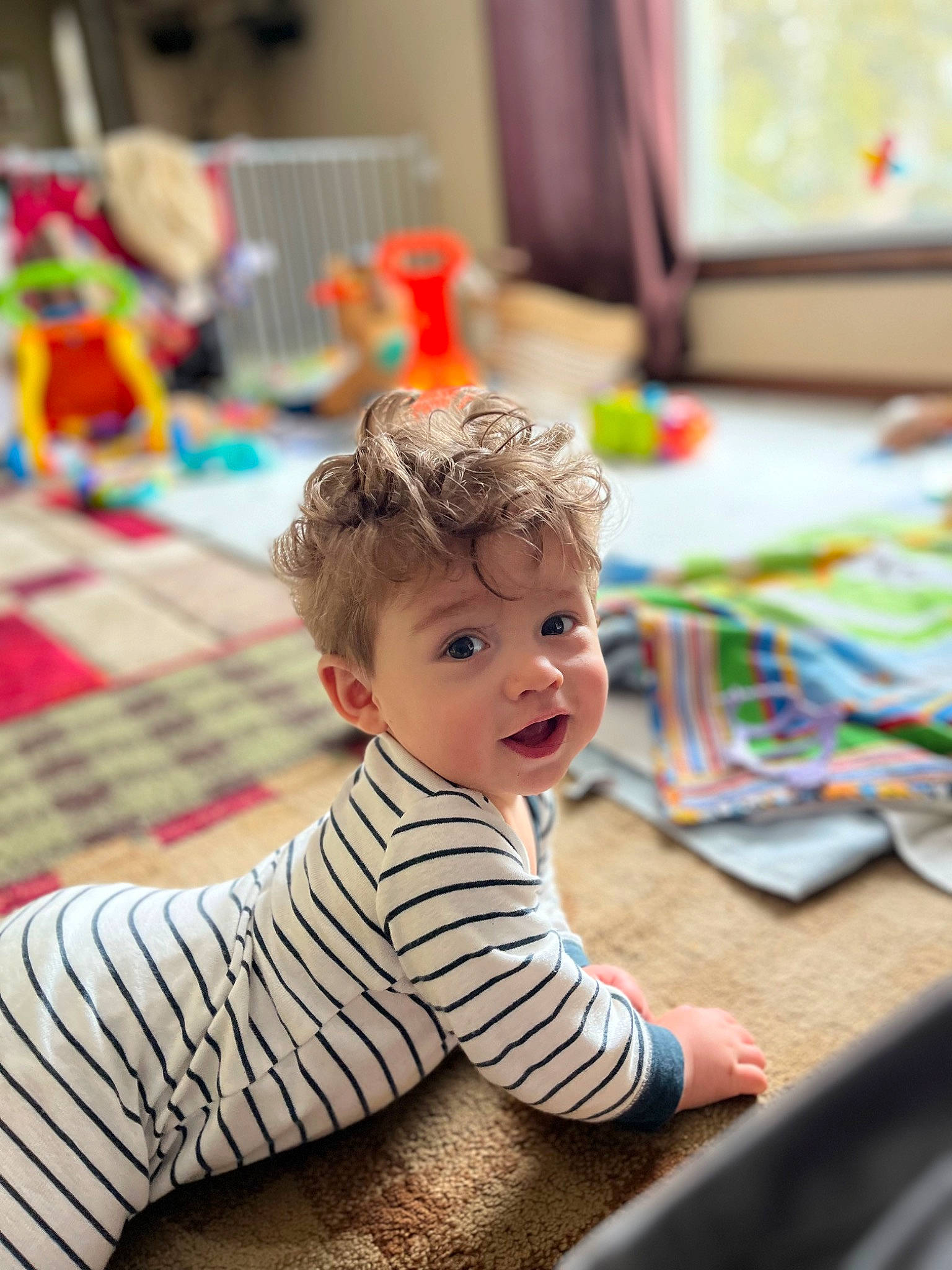 Kaleb joined the competition — help win amazing prizes! baby, baby_toddler_clothing, child, crawling, event, floor, flooring, fun, happy, leisure, pattern, person, play, recreation, room, sitting, sleeve, smile, toddler, wood