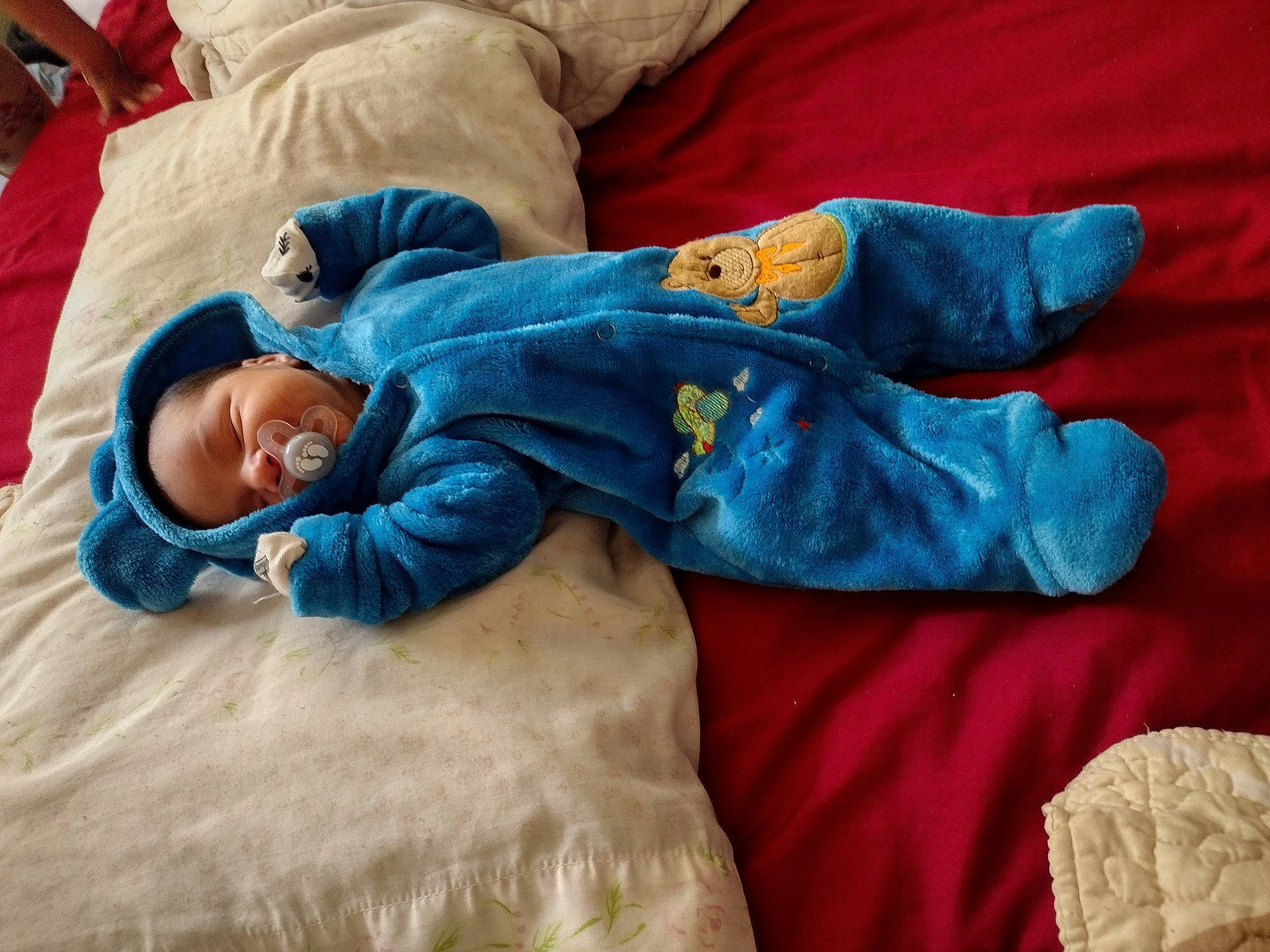 Nicolas is registered to the contest to win money with this photo: baby, baby_toddler_clothing, bed_sheet, bedding, bedtime, child, comfort, couch, denim, electric_blue, happy, human_leg, linens, nap, person, room, sitting, sleeve, smile, textile