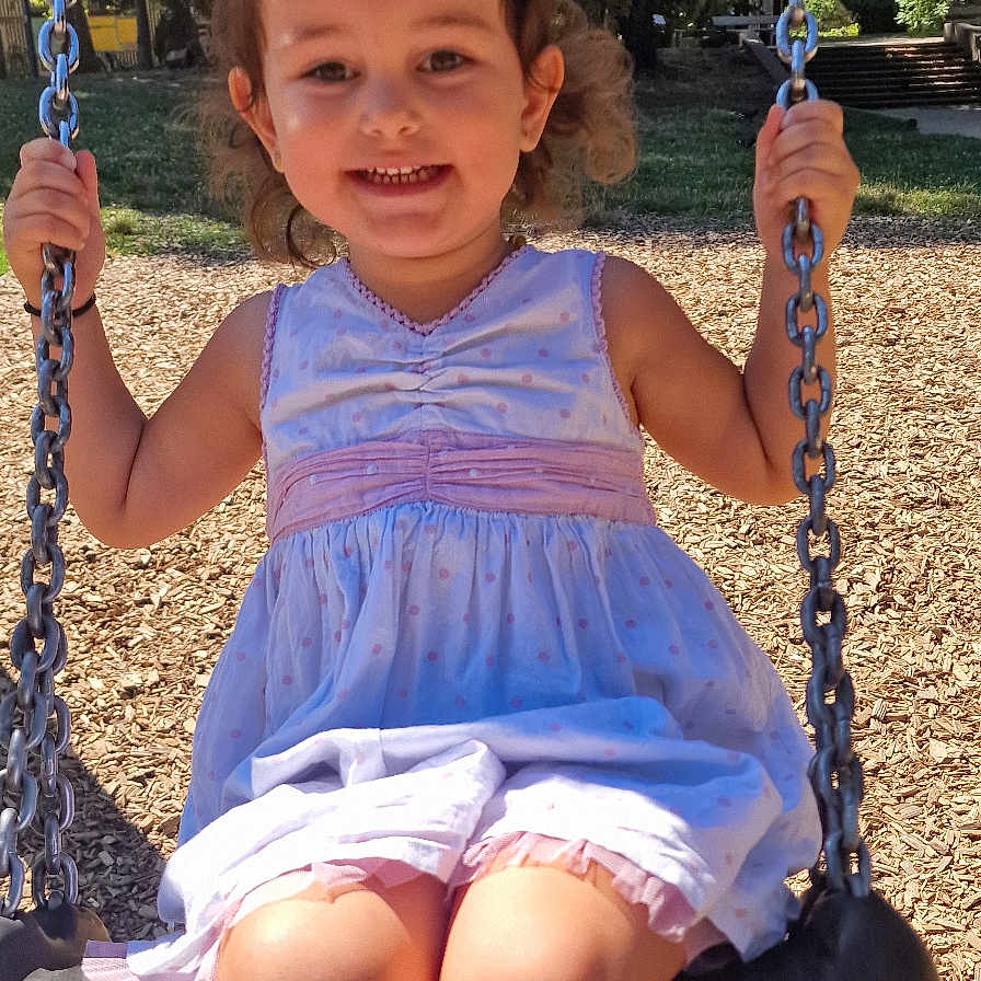 Miah participe au concours pour gagner de l'argent avec cette photo : accessories, child, clothing, dress, face, female, girl, grass, head, nature, outdoorplayarea, outdoors, park, person, photography, plant, playarea, portrait, shorts, toy