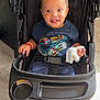 toddler, child, stroller, sneakers, smile, indoor, clothing, hair, hand, seatbelt, footwear, floor, black, blue, toy, baby, person, cute, happy, portrait