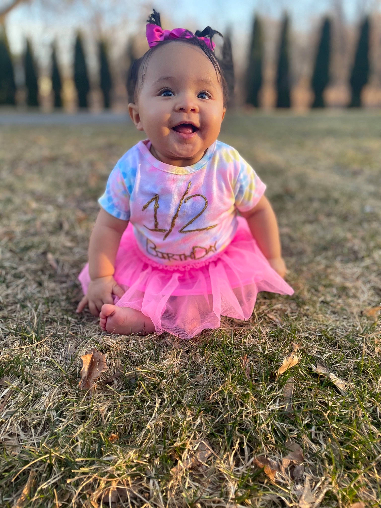 Jahzara is registered to the contest to win money with this photo: baby, baby_toddler_clothing, eye, face, flash_photography, grass, grass_family, grassland, happy, hat, iris, people_in_nature, person, photograph, pink, plant, sky, smile, summer, sunlight