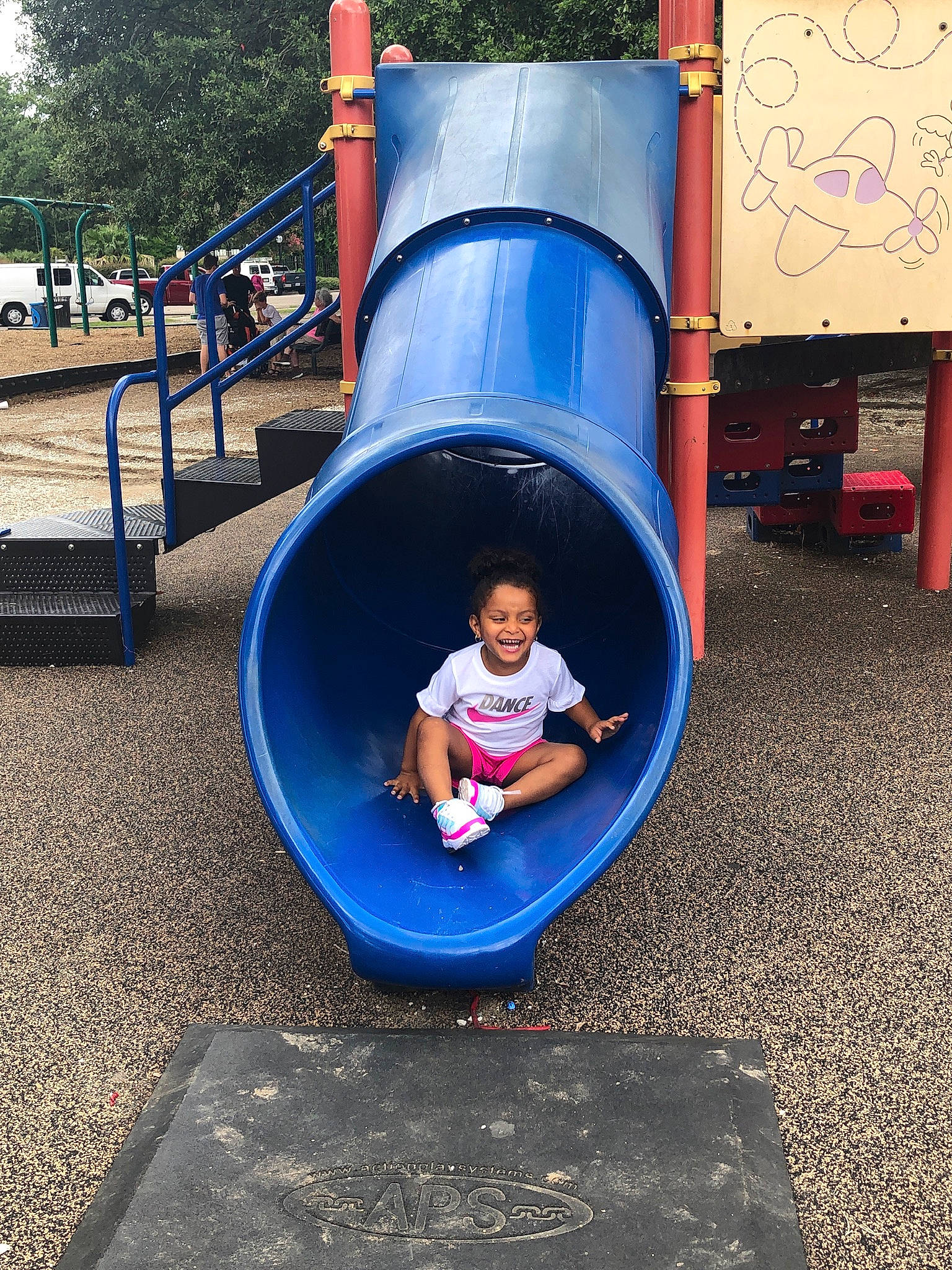 Jaliyah is registered to the contest to win money with this photo: baby, baby_toddler_clothing, child, chute, city, electric_blue, fun, grass, leisure, outdoor_play_equipment, person, play, playground, playground_slide, recreation, t_shirt, toddler, tree