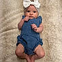 baby, infant, child, headband, bow, romper, blue_clothing, blanket, soft_texture, lying_down, cute, small_hands, bare_feet, skin, face, eyes, indoor, portrait, adorable, curious