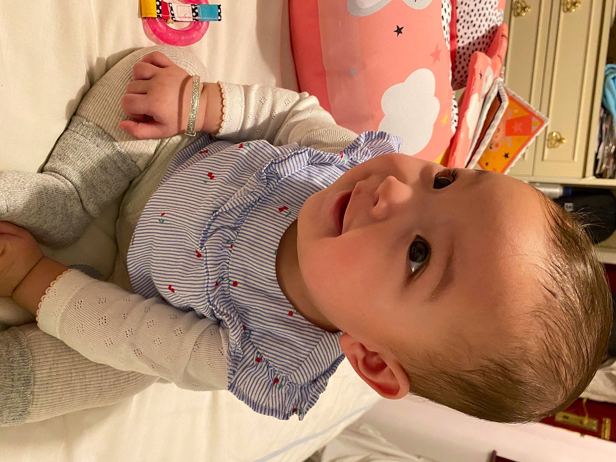 Ella-mai is registered to the contest to win money with this photo: baby, baby_toddler_clothing, bracelet, cheek, child, ear, eyelash, lamp, lighting_accessory, lip, nail, person, picture_frame, skin, sweater, toddler, wrist