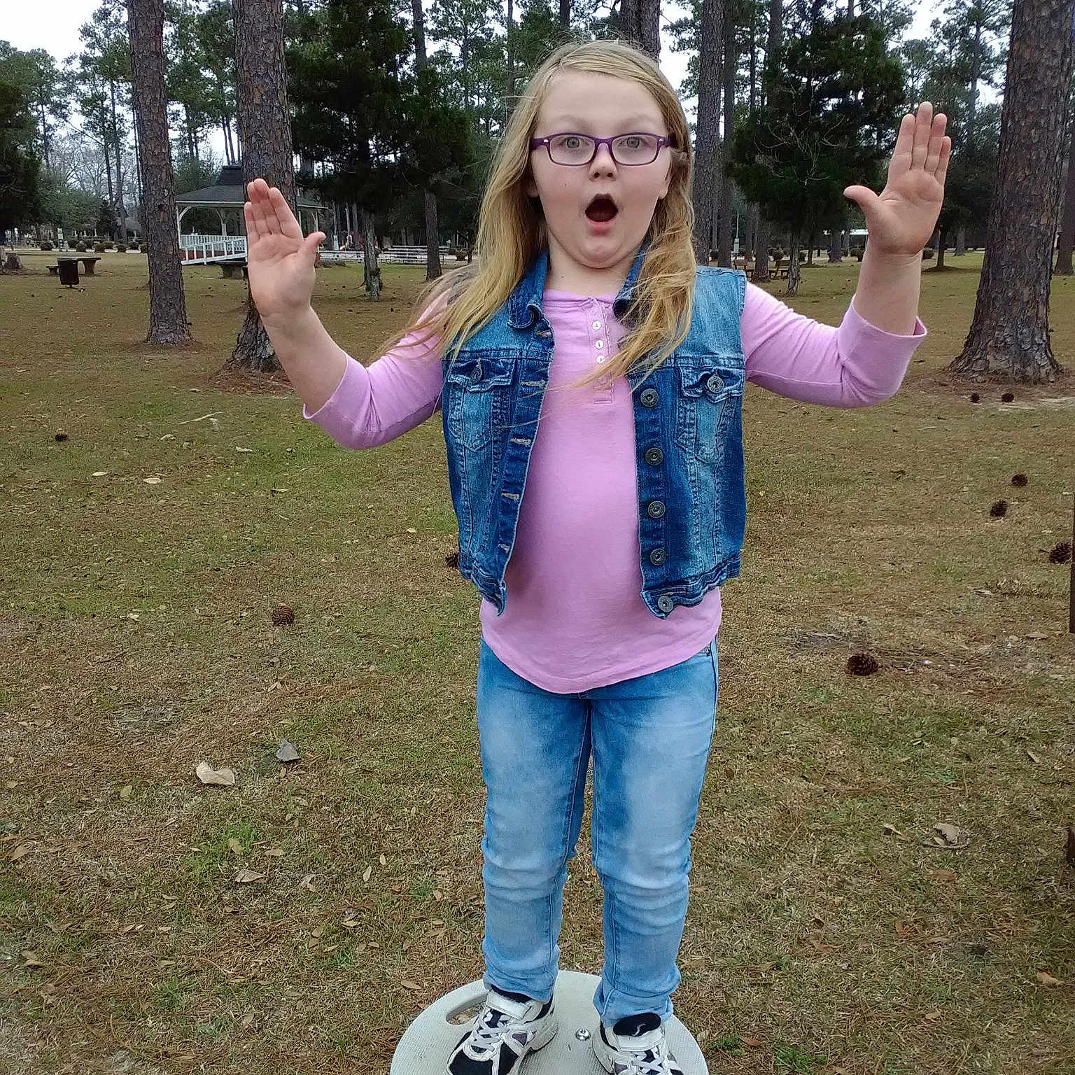 Ashlynn joined the competition — help win amazing prizes! child, footwear, fun, gesture, person, photography, play, recreation, smile, surprise, tree, vacation