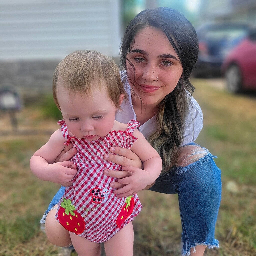 Ariella joined the competition — help win amazing prizes! baby, baby_toddler_clothing, child, face, facial_expression, fun, gesture, grass, happy, jeans, joy, leg, leisure, people_in_nature, person, plant, shoulder, skin, smile, summer