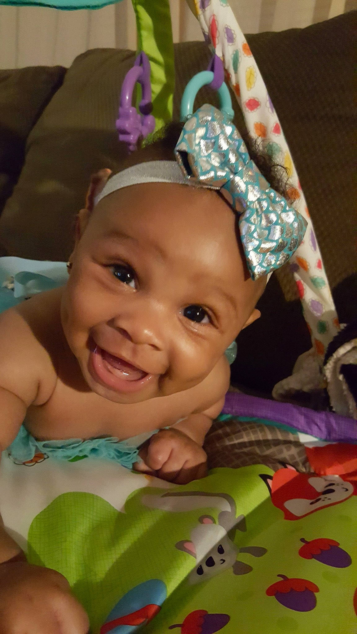 Kristen is registered to the contest to win money with this photo: baby, cheek, child, forehead, head, headgear, headwear, joy, person, skin, smile, toddler