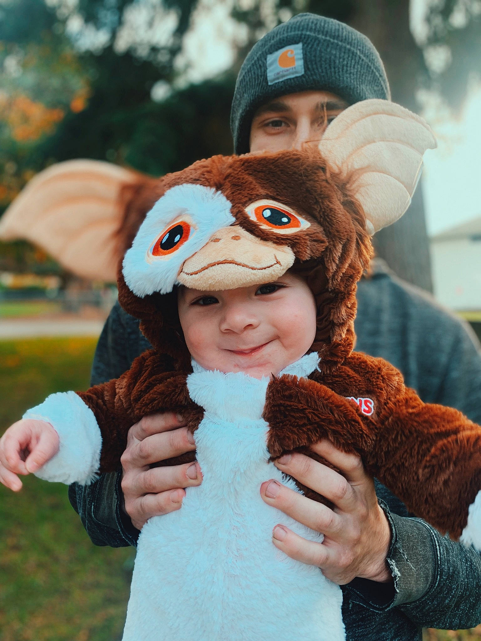 Tyrion is registered to the contest to win money with this photo: brown_hair, cap, child, costume, fawn, finger, fun, fur, gesture, glove, hand, happy, headgear, headwear, interaction, joy, owl, person, plush, recreation