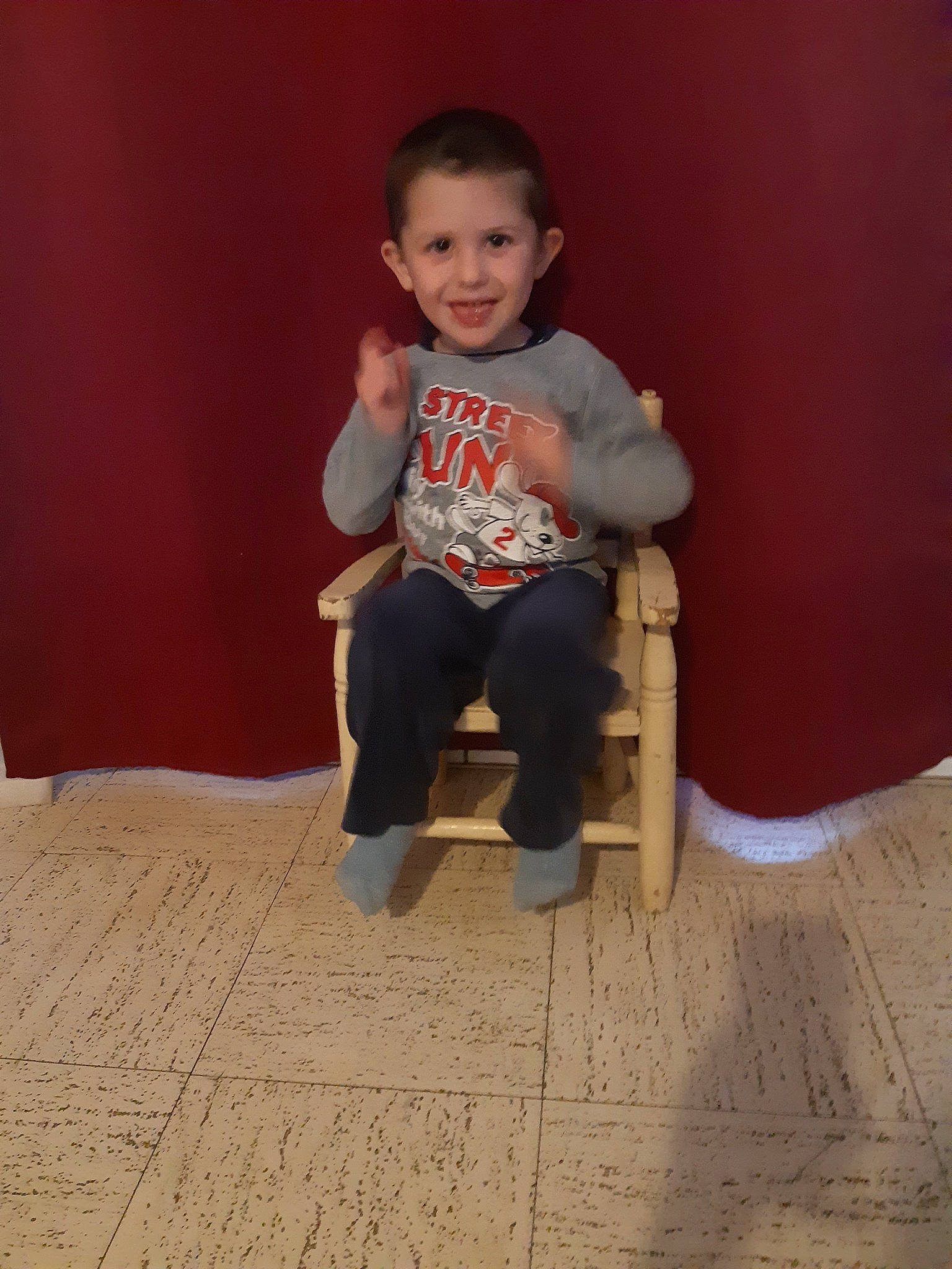 Nolan participe au concours pour gagner de l'argent avec cette photo : chair, child, floor, flooring, fun, furniture, joy, person, play, sitting, skin, smile, standing, toddler, wood
