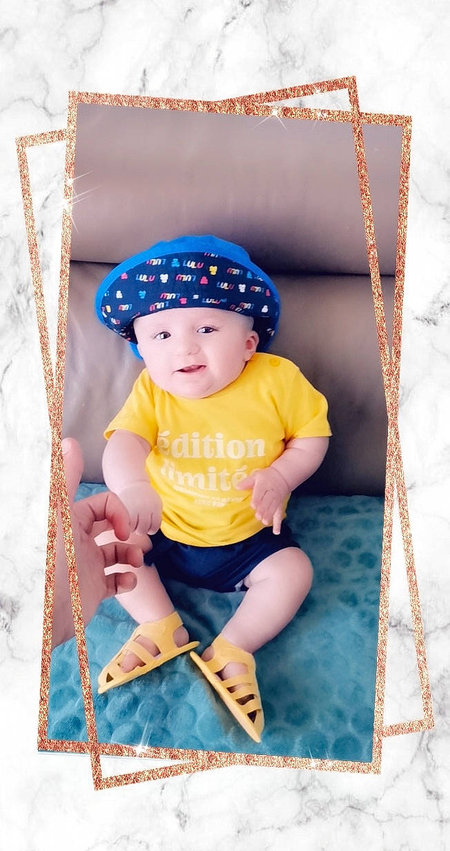 Malonn participe au concours pour gagner de l'argent avec cette photo : baby, baby_products, baby_toddler_clothing, cap, child, electric_blue, eye, face, fashion_accessory, fun, happy, headwear, pattern, person, photograph, pink, product, purple, shorts, sleeve
