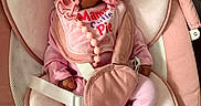 Saige joined the competition — help win amazing prizes! baby, infant, pink_clothing, pacifier, baby_seat, bonnet, soft_cushion, cute, child, indoor, clothing, person, newborn, baby_accessory, fabric, seat_belt, laundry_basket, footwear, portrait, comfort