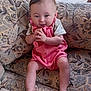 Azzalia is registered to the contest to win money with this photo: baby, child, pink_outfit, couch, patterned_fabric, hands, legs, feet, smile, indoor, curtains, window, light, face, person, seated, cute, happy, infant, clothing