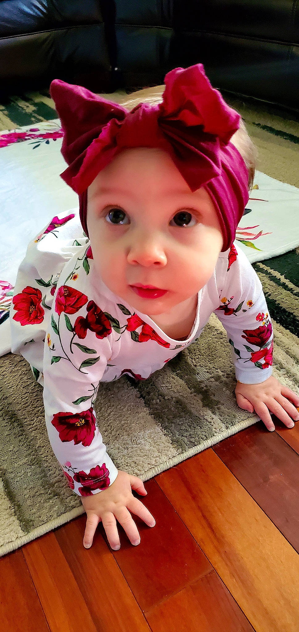 Freya joined the competition — help win amazing prizes! baby, baby_toddler_clothing, cheek, child, flooring, grass, happy, hardwood, hat, headwear, lip, magenta, outerwear, pattern, person, pink, red, skin, sleeve, toddler