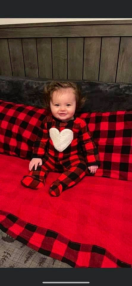 Kynleigh is registered to the contest to win money with this photo: baby, baby_toddler_clothing, carmine, child, comfort, floor, flooring, fun, linens, pattern, person, plaid, product, room, sitting, sleeve, smile, tartan, textile, toddler