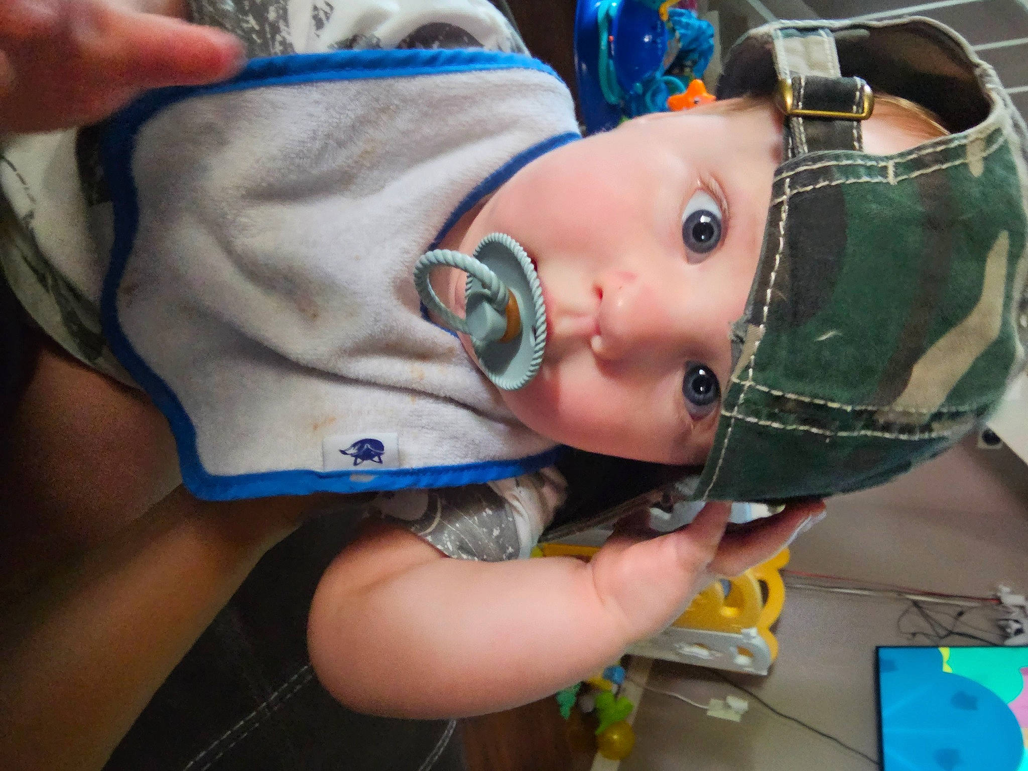 Gavin is registered to the contest to win money with this photo: baby, baby_products, baby_toddler_clothing, blue, cheek, child, costume, electric_blue, eyelash, fashion_accessory, finger, fun, hand, hat, headwear, nail, person, personal_protective_equipment, service, thumb