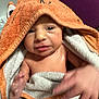 Jaxson is registered to the contest to win money with this photo: baby, child, towel, orange, hood, cute, skin, hand, face, eyes, newborn, infant, wrapped, clothing, indoor, person, expression, soft, warm, blanket