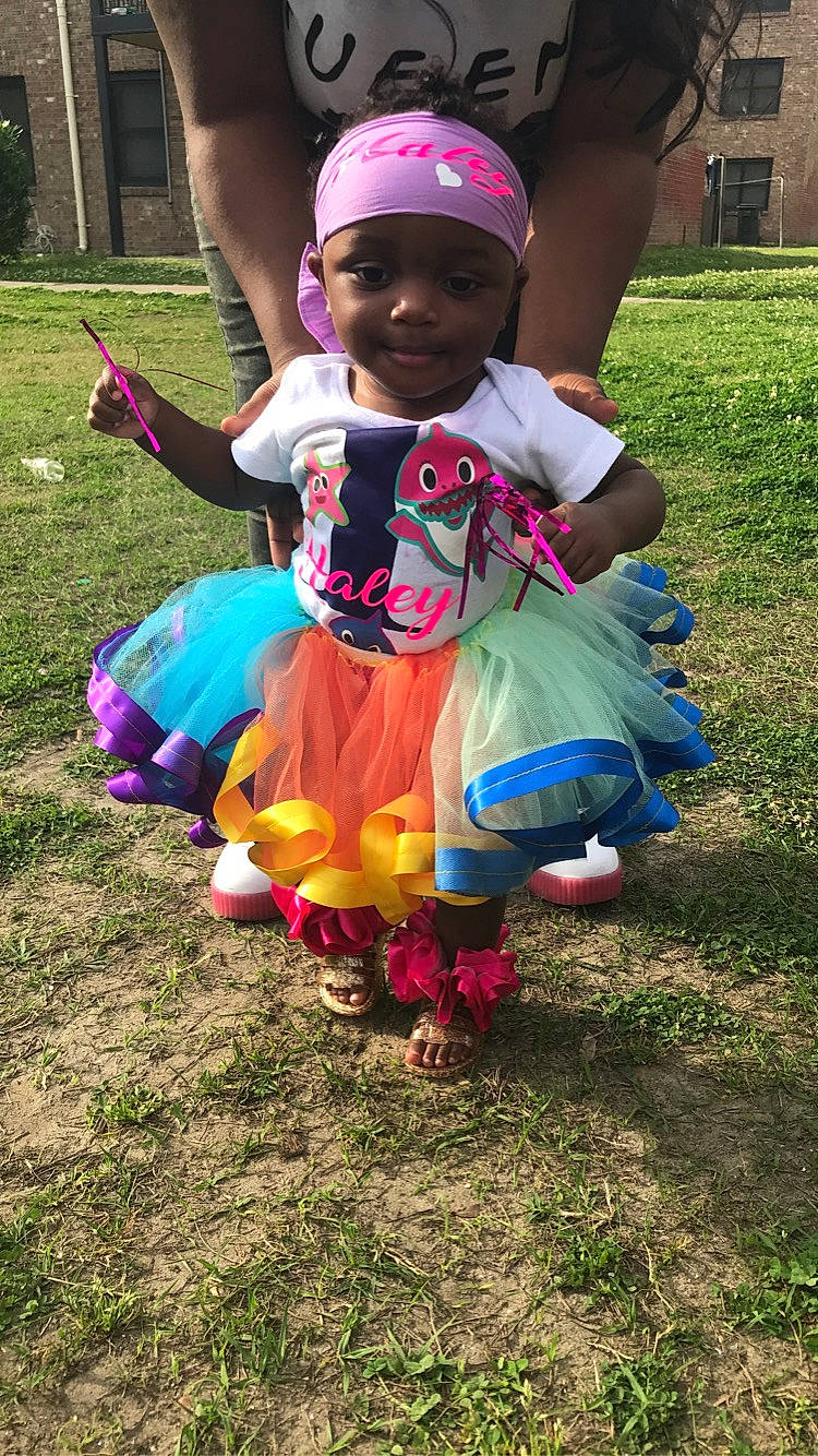 Haley joined the competition — help win amazing prizes! baby, baby_products, baby_toddler_clothing, baseball_cap, cap, child, fashion_accessory, hat, headwear, human, lawn, magenta, person, pink, play, purple, sandal, shoe, sock, toddler