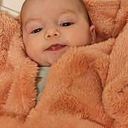 Olivia is registered to the contest to win money with this photo: baby, infant, blanket, face, head, skin, eyes, mouth, expression, soft, warm, cozy, child, person, portrait, newborn, cute, indoor, smile, clothing