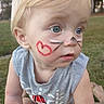 Dakota joined the competition — help win amazing prizes! child, toddler, face_paint, heart, whiskers, outdoor, grass, blue_eyes, blonde_hair, sleeveless_shirt, curious, portrait, person, young_child, closeup, nature, summer, playful, expression, casual
