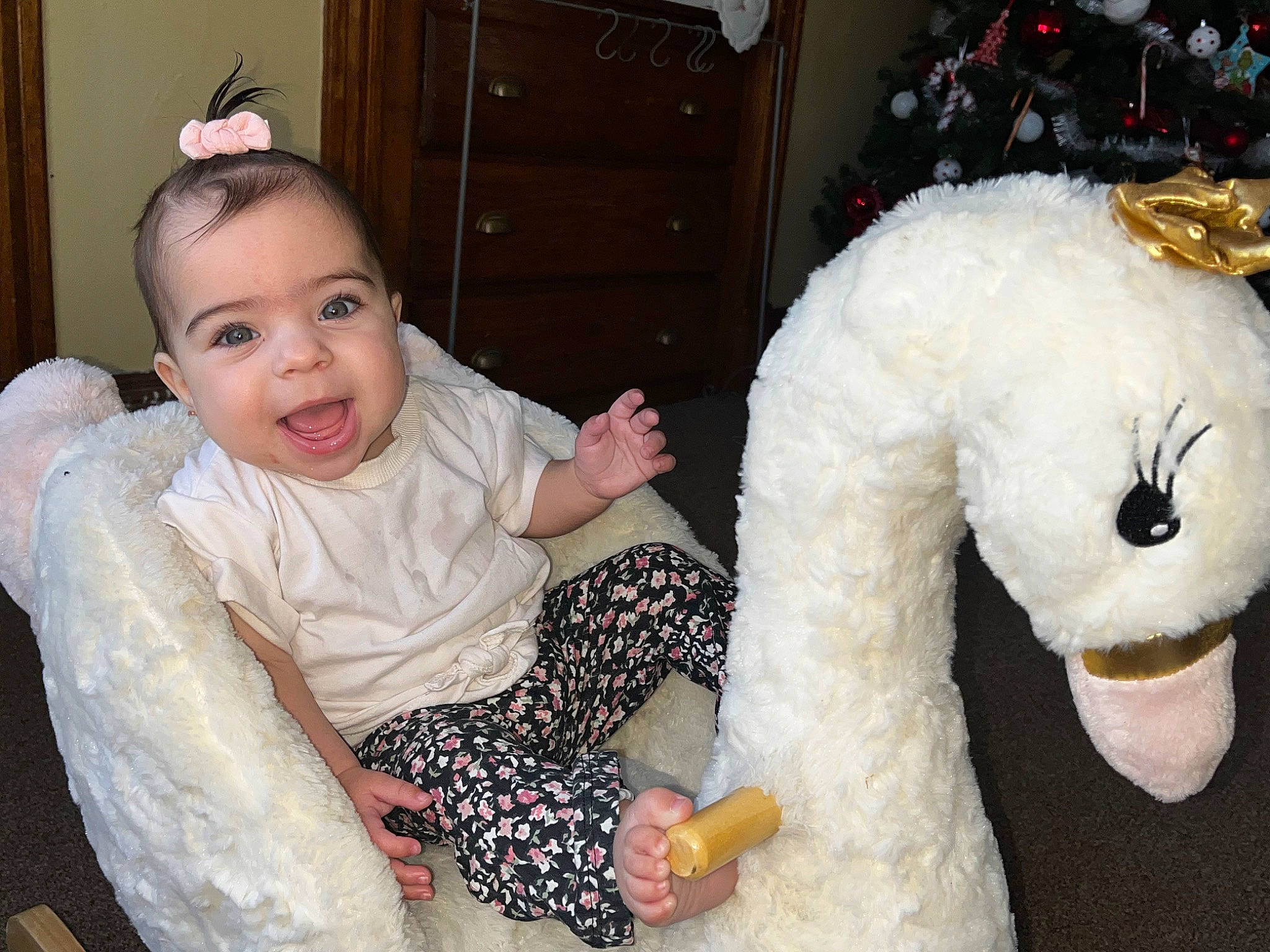 Jhené is registered to the contest to win money with this photo: _geese_and_swans, baby_toddler_clothing, child, christmas_tree, dress, duck, ducks, event, facial_expression, finger, fun, hand, happy, mammal, organ, person, smile, stuffed_toy, toddler, toy