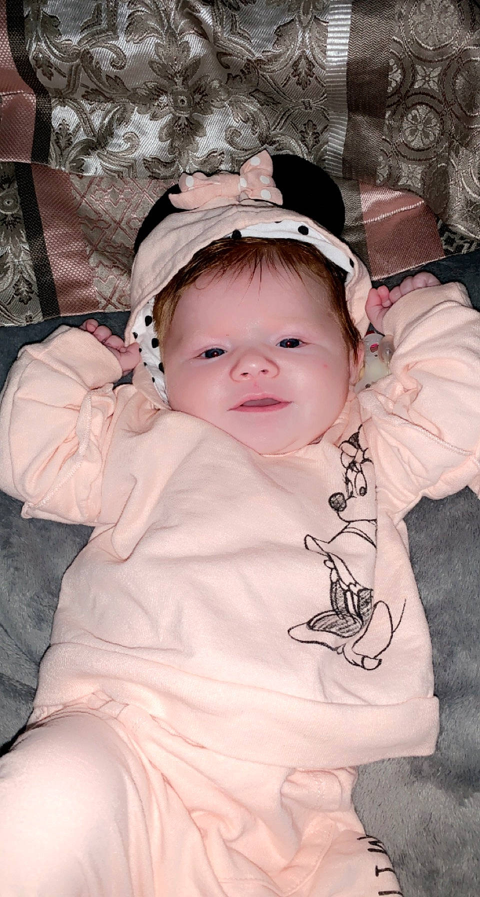 Bellarae is registered to the contest to win money with this photo: baby, baby_toddler_clothing, cheek, child, comfort, facial_expression, fashion_accessory, happy, headgear, iris, mammal, pattern, person, pink, sitting, skin, sleeve, smile, textile, toddler