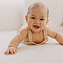 baby, smiling, crawling, child, infant, cute, happy, face, skin, hand, arm, indoors, soft_light, portrait, young, person, clothing, closeup, expression, background_blur