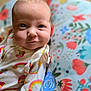 Alora joined the competition — help win amazing prizes! baby, infant, face, smile, eyes, clothing, rainbow, strawberry, blanket, floral, colorful, cute, portrait, child, young, soft, closeup, lying, happy, cozy