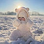 Thaïssya participe au concours pour gagner de l'argent avec cette photo : baby, child, cold, cute, daylight, face, frost, fuzzy, glare, hat, hood, infant, nature, outdoor, portrait, sitting, snow, sunlight, warm_clothing, winter
