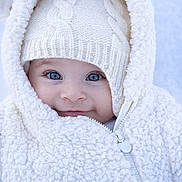Thaïssya a rejoint le concours — aidez-le/la à gagner de superbes lots ! baby, blue_eyes, child, closeup, cold_weather, cute, face, fleece, fluffy, headwear, hood, infant, knit_hat, outdoor, portrait, smile, warm, white_jacket, winter_clothing, zipper