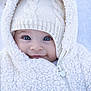 baby, blue_eyes, child, closeup, cold_weather, cute, face, fleece, fluffy, headwear, hood, infant, knit_hat, outdoor, portrait, smile, warm, white_jacket, winter_clothing, zipper