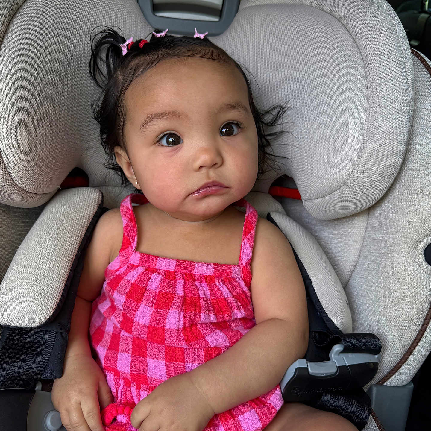 Selena joined the competition — help win amazing prizes! accessories, baby, bodypart, car, car_interior, carseat, cushion, diaper, face, finger, hand, head, headrest, homedecor, person, photography, portrait, sitting, transportation, vehicle