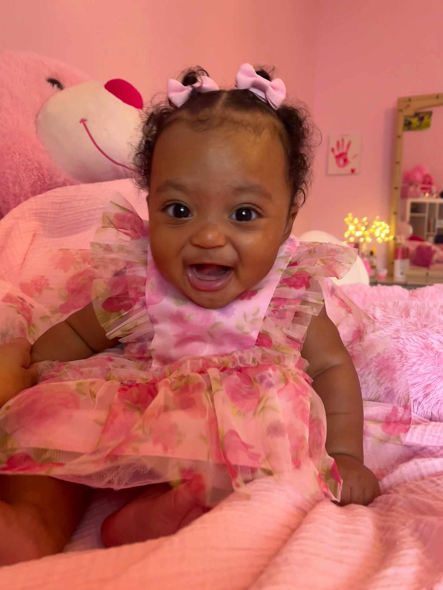 Tavare Thrasher joined the competition — help win amazing prizes! baby, child, pink_dress, bows, smiling, happy, bedroom, plush_toy, stuffed_animal, pink_theme, curly_hair, infant, cute, portrait, indoor, childhood, tulle, decor, soft_lighting, cozy