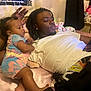 Tavare Thrasher is registered to the contest to win money with this photo: baby, child, man, person, bed, pillow, blanket, poster, room, indoor, clothing, onesie, hairstyle, skin, furniture, relaxed, curious, casual, technology, phone
