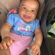 Srynity joined the competition — help win amazing prizes! baby, blue_shirt, bottle, child, cushion, cute, eyes, face, hand, happy, indoors, infant, mouth, person, pink_clothing, portrait, seat, skin, smiling, toy