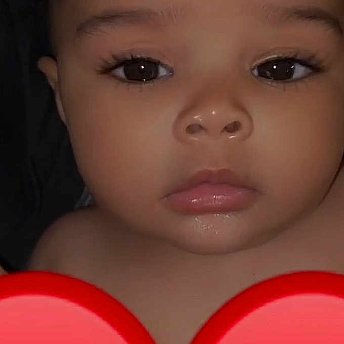 Srynity is registered to the contest to win money with this photo: adorable, baby, child, closeup, cute, emoji, expressionless, eyelashes, eyes, face, head, human, indoors, infant, lips, nose, portrait, red_heart, skin, young