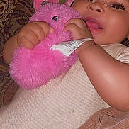 Srynity joined the competition — help win amazing prizes! baby, child, plush_toy, pink, couch, patterned_fabric, smiling, cute, infant, closeup, cozy, soft_texture, hands, face, lying_down, eyes, heart_filter, toy, comfort, casual_clothing