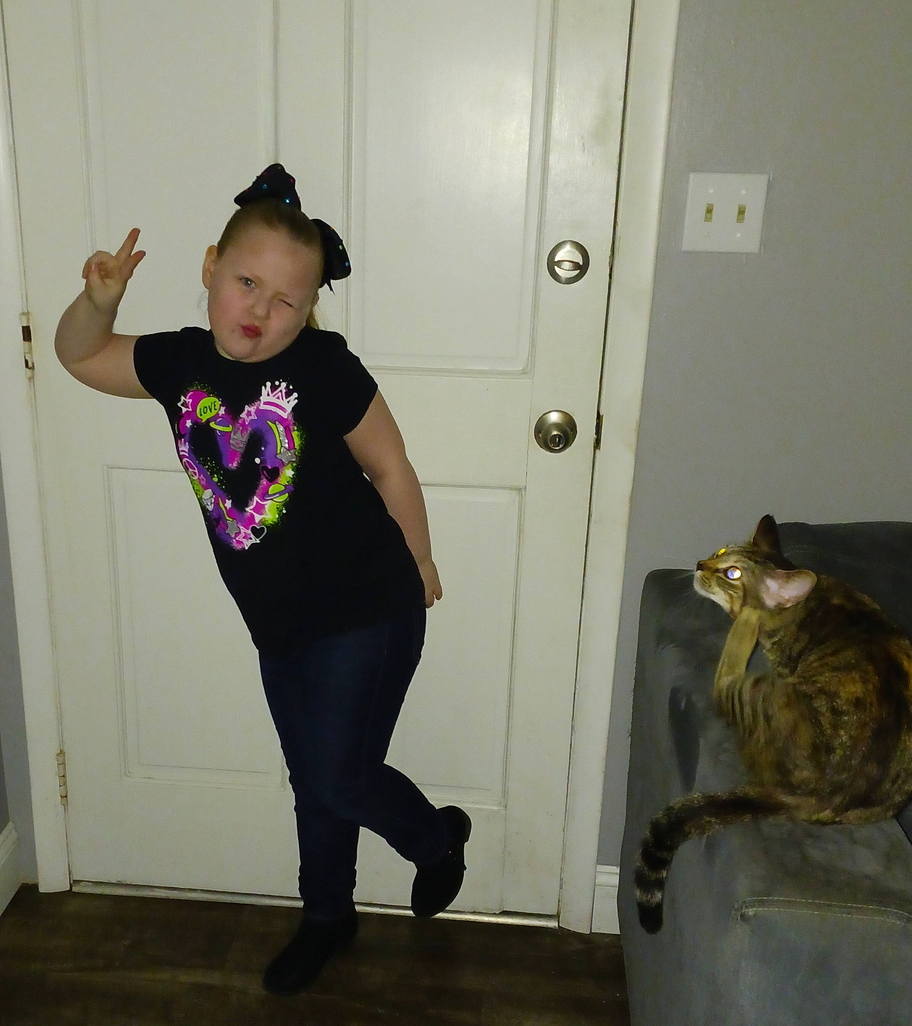 Alexis joined the competition — help win amazing prizes! abdomen, door, elbow, electric_blue, felidae, flooring, human_leg, knee, magenta, person, shoulder, sleeve, sportswear, standing, sweatpant, t_shirt, thigh, toddler, trunk, waist